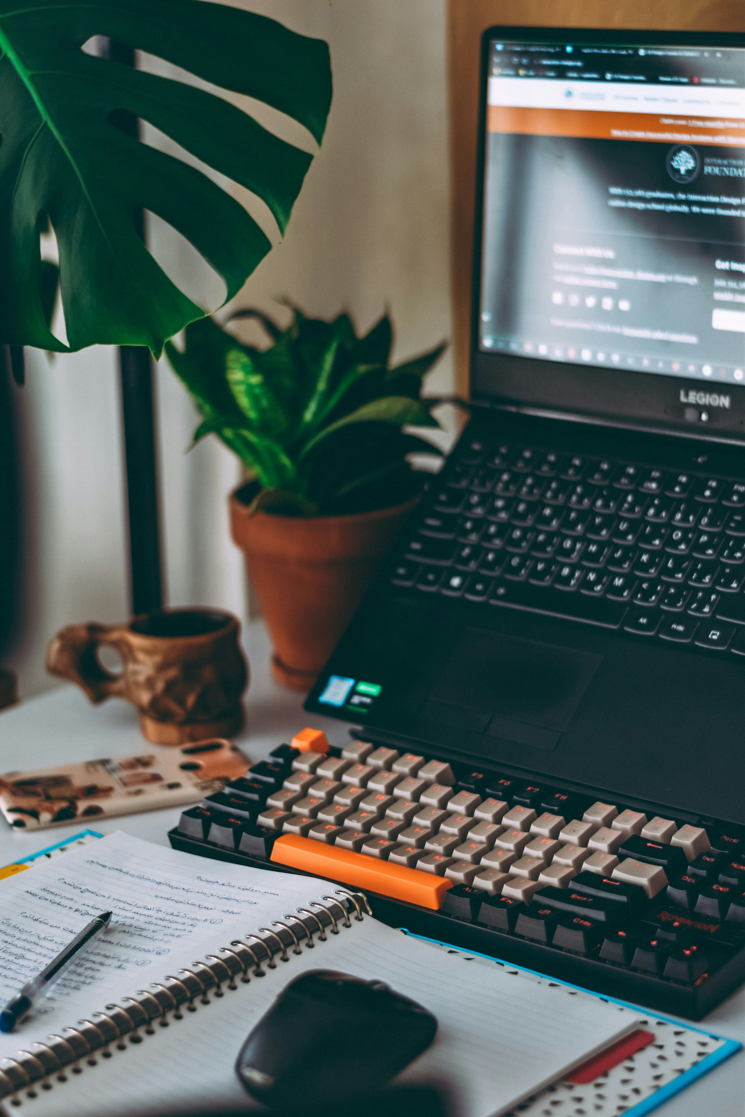 Modern workspace featuring a laptop surrounded by plants, showcasing seamless and functional web design.